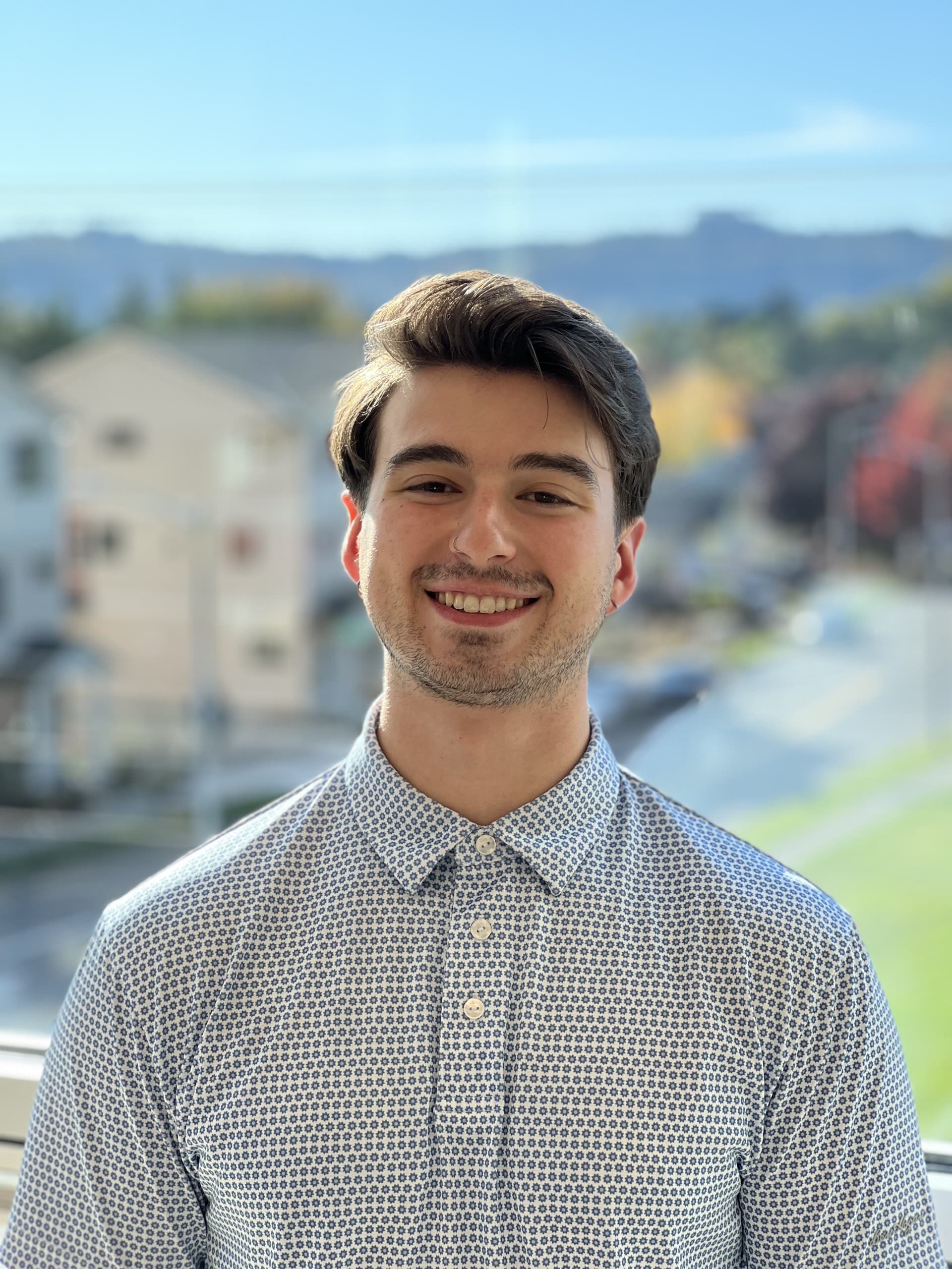 Headshot of Caleb Oster, PTA